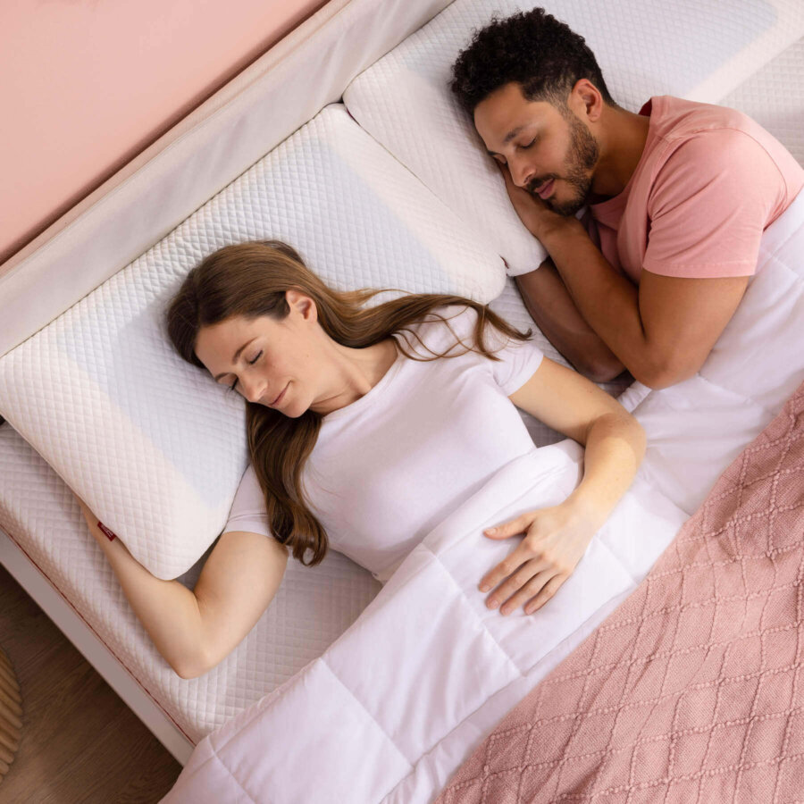 Woman and man sleeping with their Douglas Cooling Gel Pillows