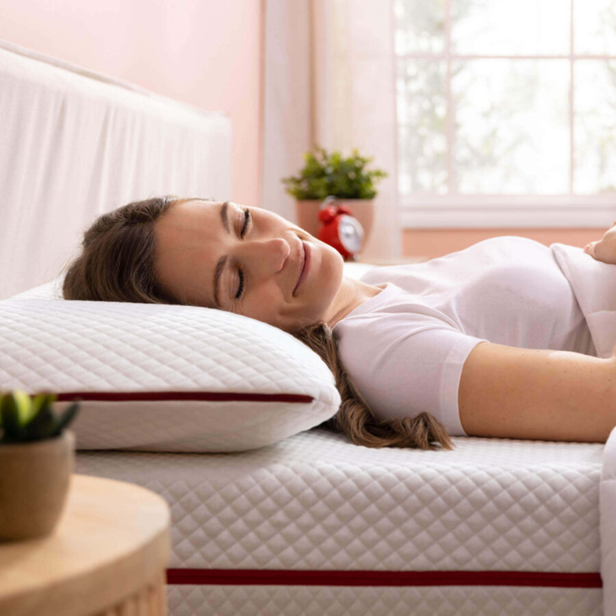 Woman sleeping peacefully on her back with a Douglas Cooling Gel Pillow