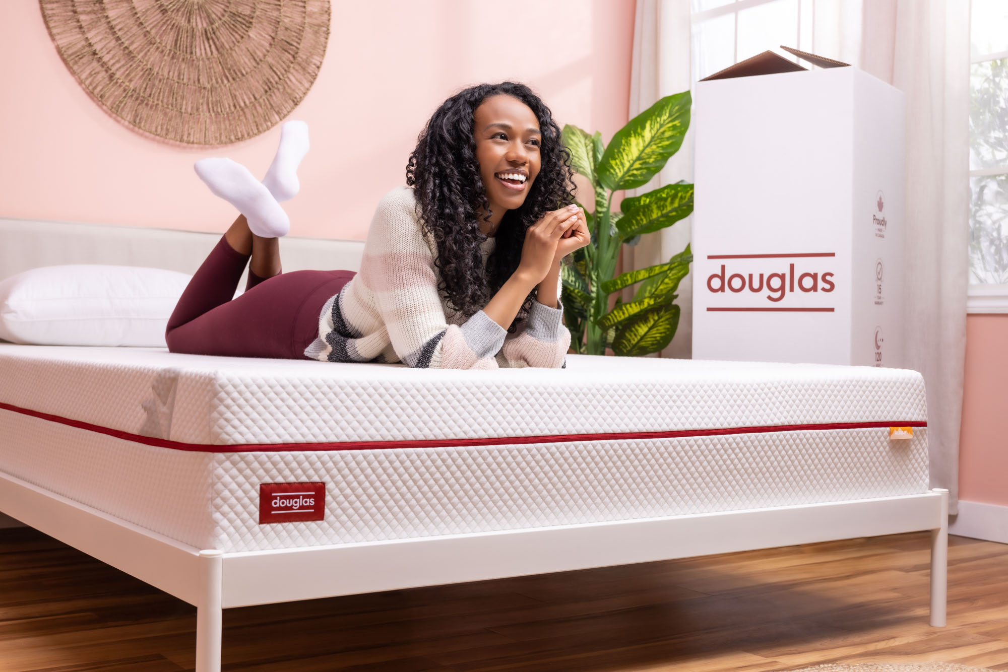 woman on douglas mattress using cellphone
