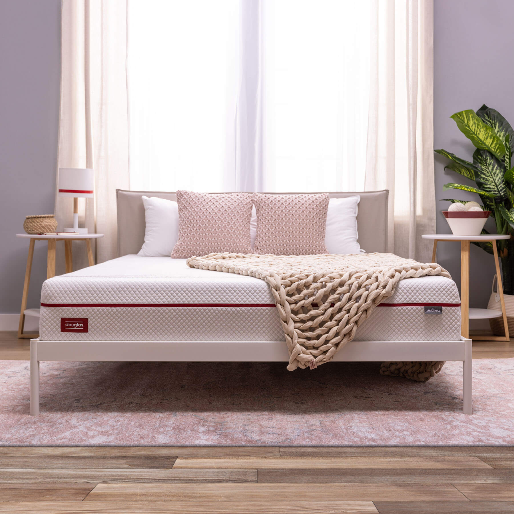 DB-BWB-Carousel-Cream-5 Cream coloured Douglas Braided Weighted Blanket on a bed