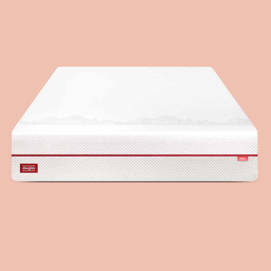 Front view of Douglas Summit mattress on a pink background