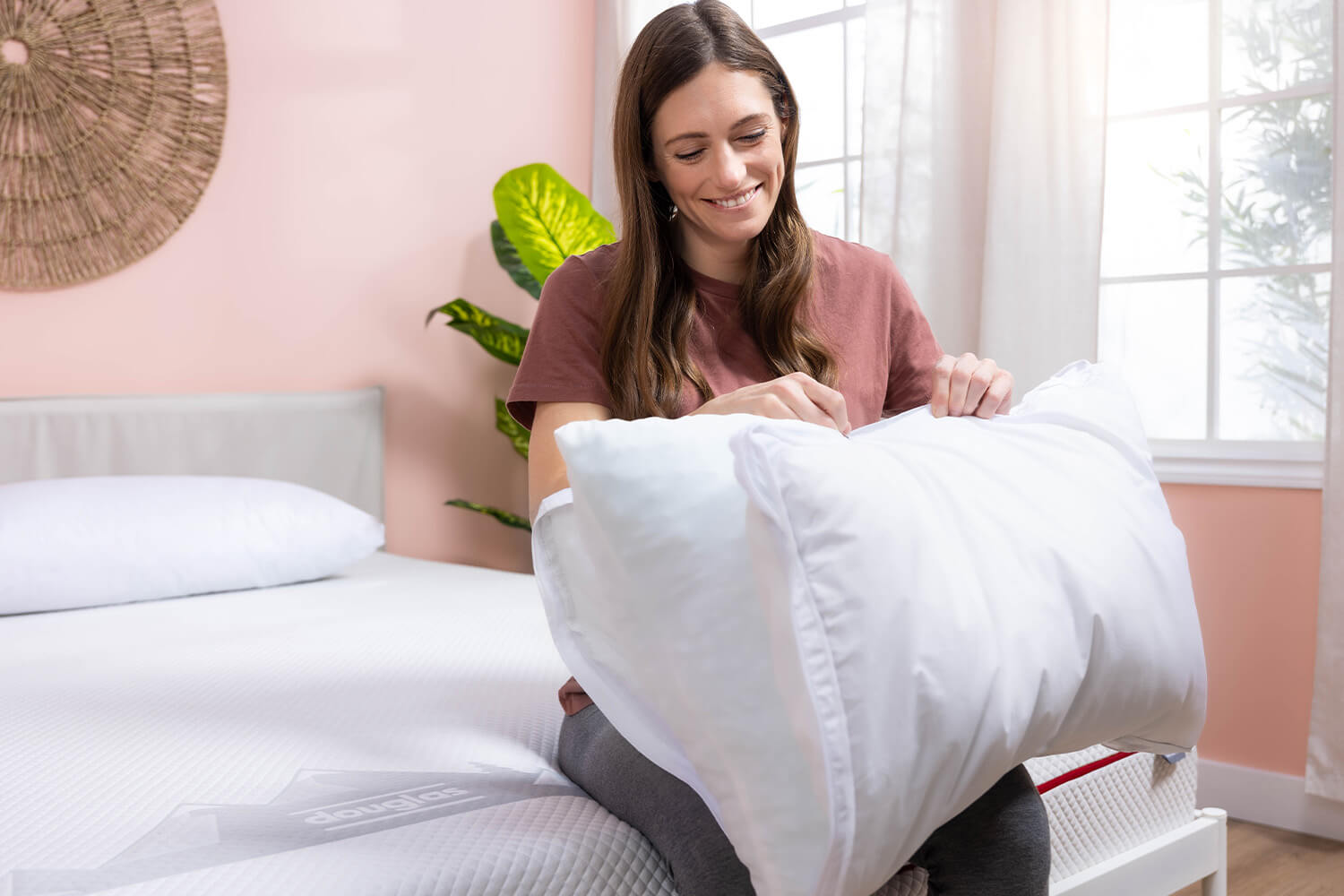Woman unzipping the top cover on the Adjustable Memory Foam Pillow