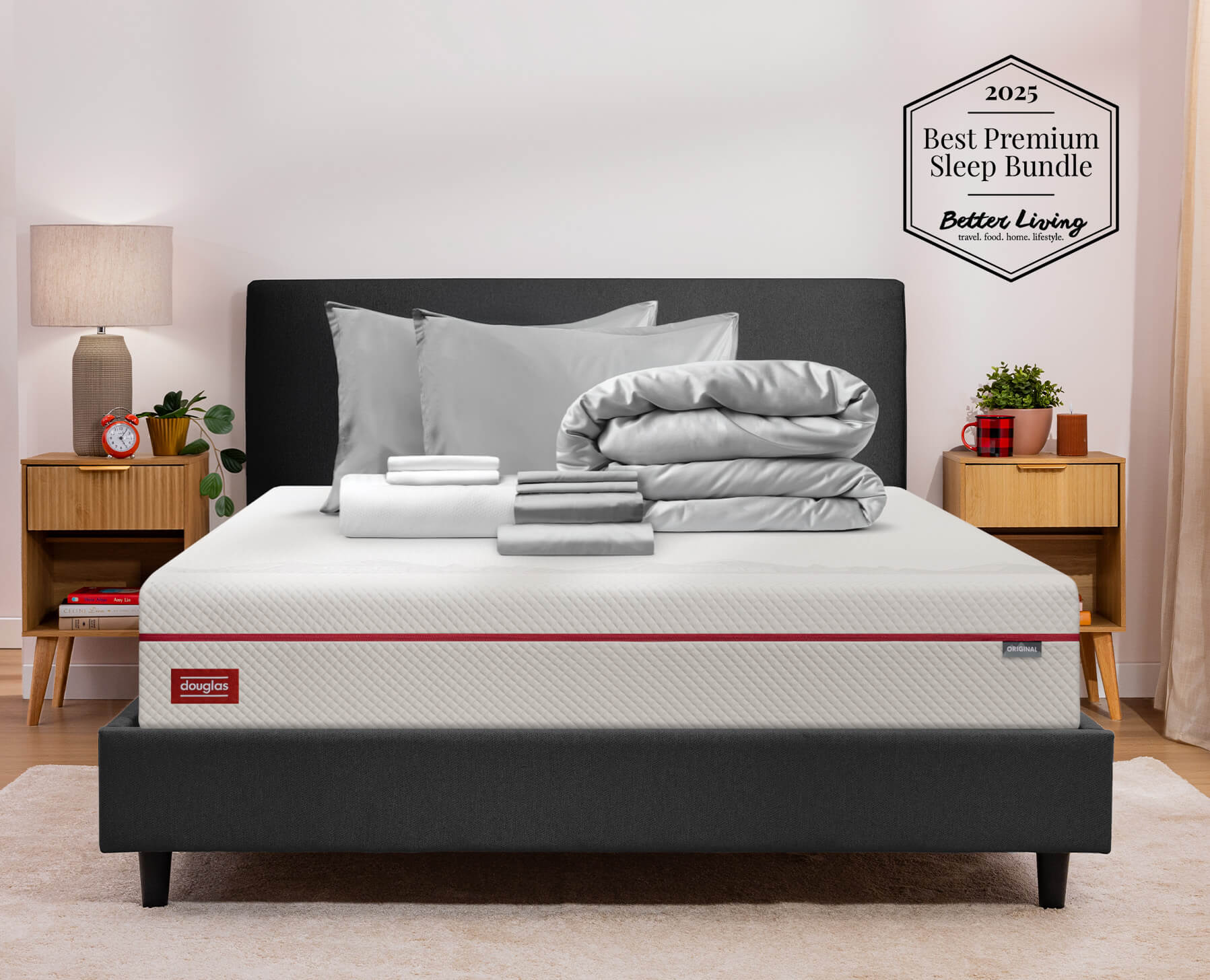 A grey premium sleep bundle sits neatly folded on a Douglas Original Mattress