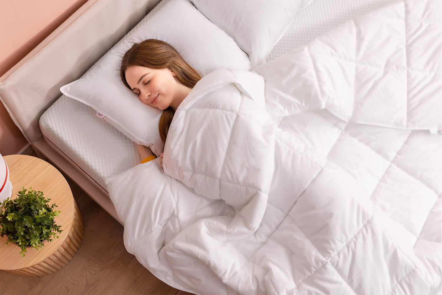 Woman sleeping peacefully with a Douglas Down Alternative Duvet