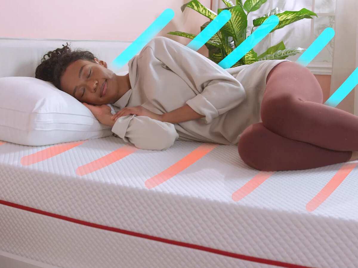 A woman sleeping comfortably on a cooling mattress