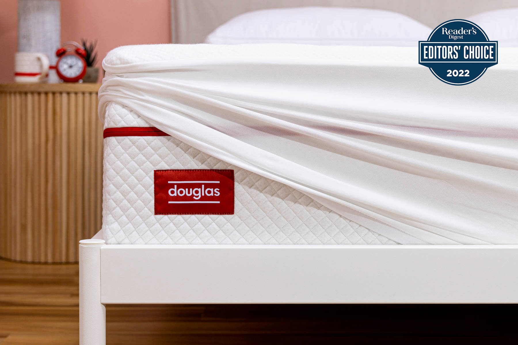 A Douglas mattress protector covers a Douglas mattress
