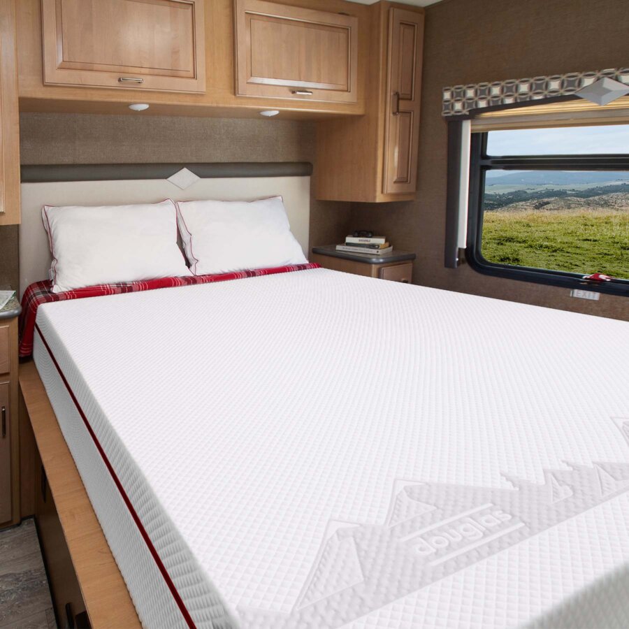 A Douglas RV mattress sits inside a recreational vehicle.
