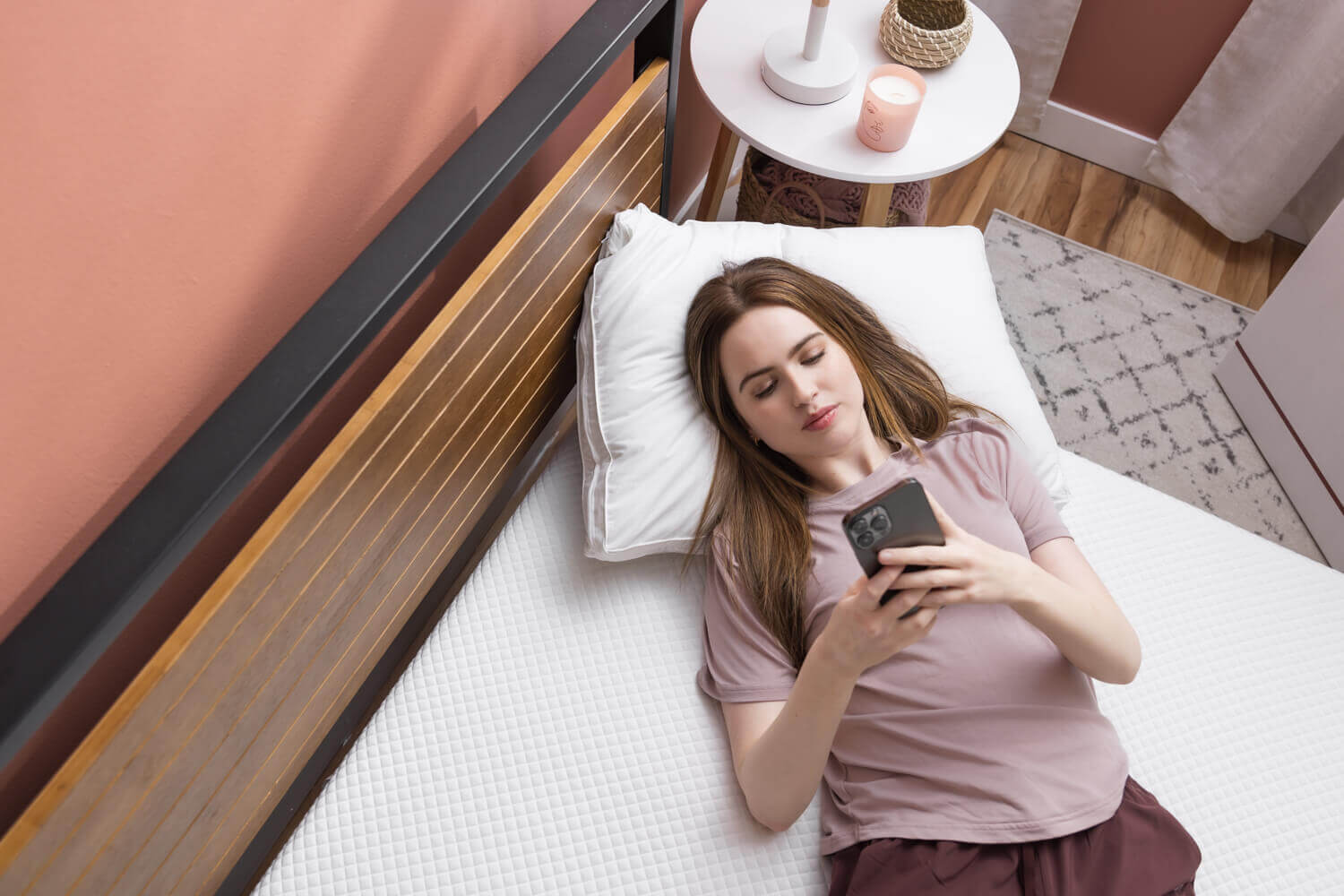 woman on douglas mattress using cellphone
