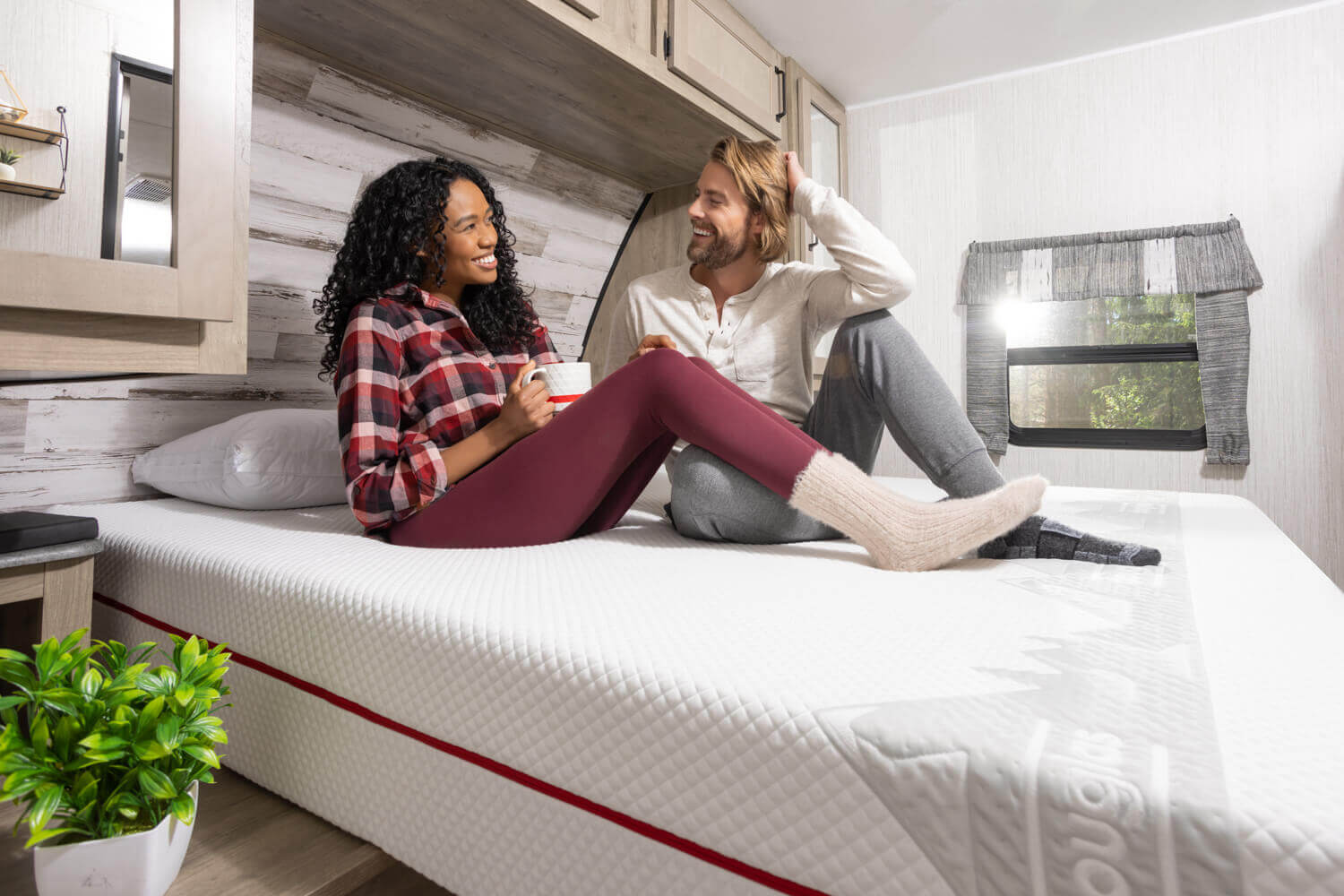 Woman and man enjoying their Douglas Alpine RV mattress