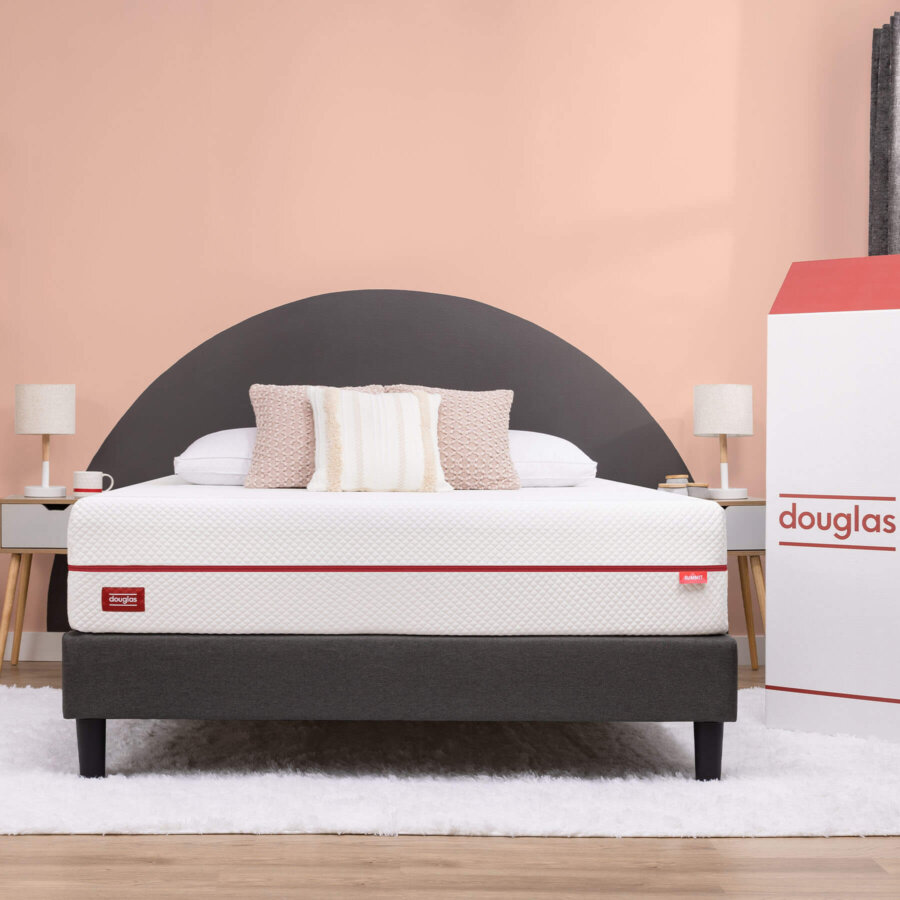 Douglas Summit mattress in a bedroom with its delivery box