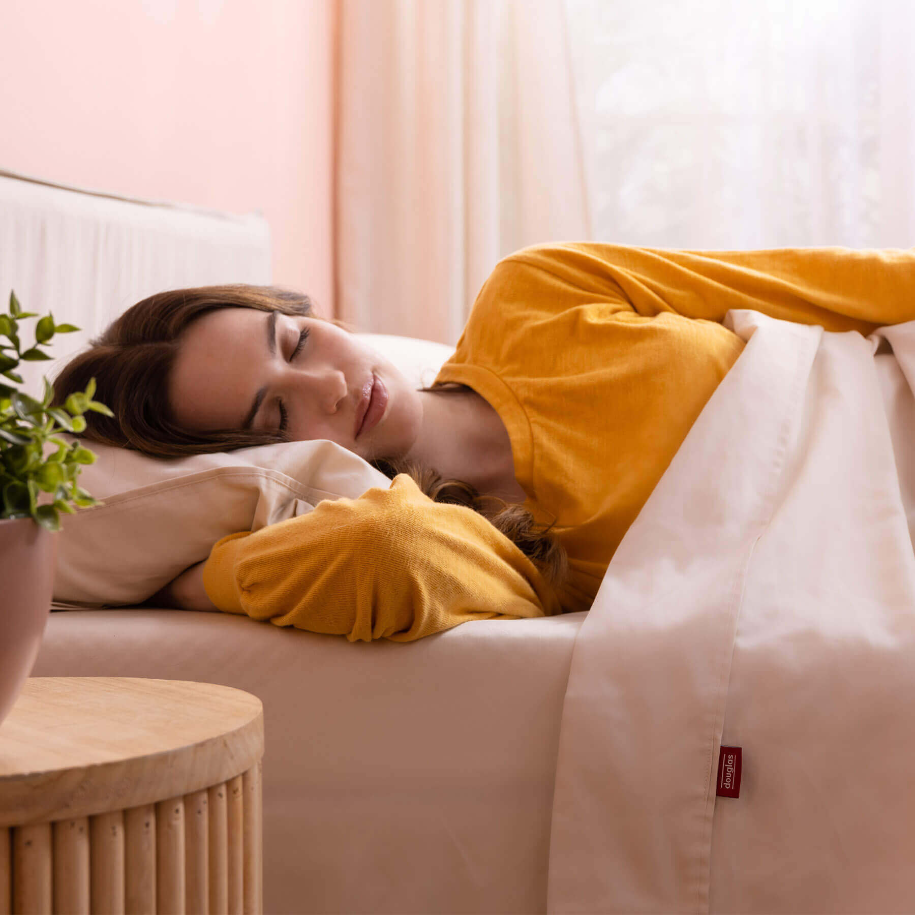 egyptian-cotton-sheets-carousel-8 woman resting peacefully with her Douglas Egyptian Cotton Sheets
