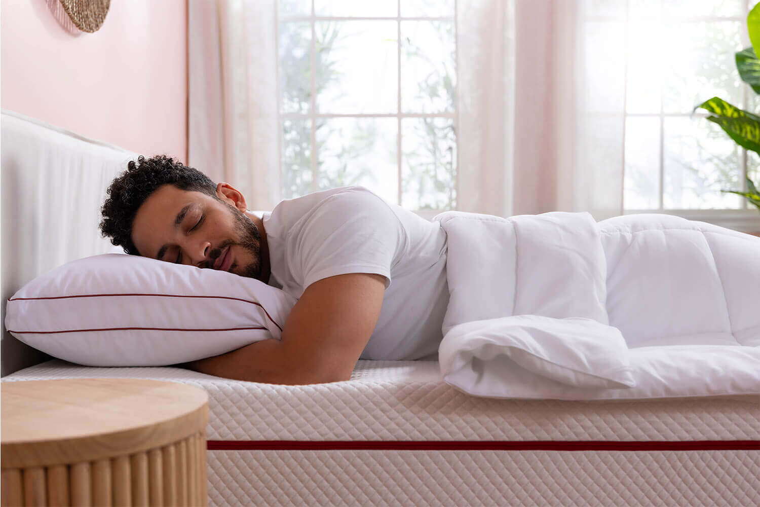 Man smiling and lying on Douglas Alpine mattress